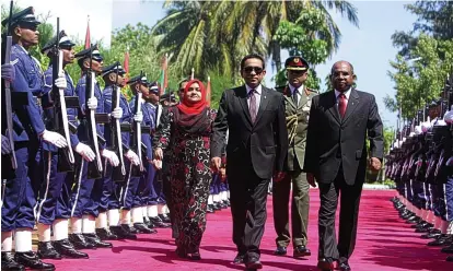  ??  ?? Representi­ng a despot: Mrs Blair, whose firm’s client was Maldives President Yameen, in dark glasses (above)