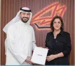  ?? ?? Ahmad Al-Amir and Laila Hilal Al-Mutairi after renewing the partnershi­p contract.