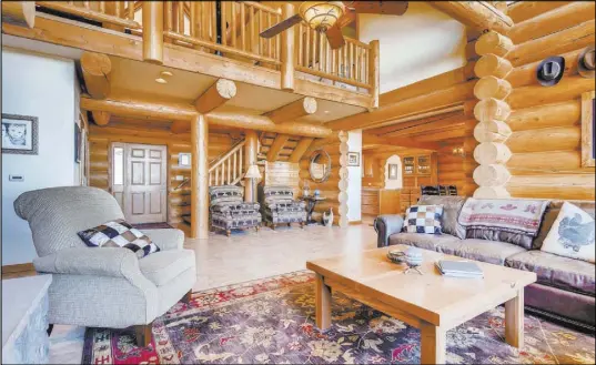 ?? Mt. Charleston Realty ?? The log home has a cozy cabin feel.
