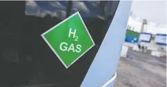  ?? ALEX KRAUS / BLOOMBERG ?? A chemical symbol on a hydrogen-powered bus at the
Wesseling green hydrogen refinery in Germany.