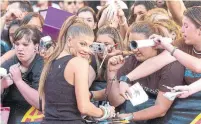  ??  ?? EYES HAVE IT: Fergie of Black Eyed Peas at a photo line at the MMVA award show in Toronto in 2005.