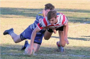  ?? PHOTO: ROBYNE WIEDMAN ?? FIVE POINTS: Toowoomba Rangers’ fullback Lachlan Sperling crosses for a try against USQ during last Saturday’s round 14 Risdon Cup match at USQ Oval.