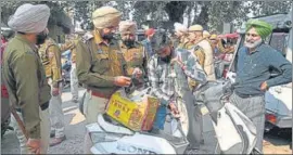  ?? AFP ?? Cops check a scooter during their special operation in Amritsar on Tuesday.