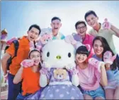  ?? PROVIDED TO CHINA DAILY ?? Visitors pose with Hello Kitty at the world’s largest Hello Kitty Park in Anji county.