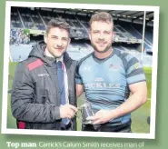  ??  ?? Top man
Carrick’s Calum Smith receives man of the match award from Charlie Shiel of Edinburgh Rugby