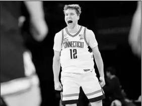  ?? MARY ALTAFFER / ASSOCIATED PRESS ?? Uconn guard Cam Spencer reacts during the Huskies’ second-round NCAA Tournament victory Sunday against Northweste­rn in New York. The top-seeded Huskies are favored in their Sweet 16 game against San Diego State, a rematch of the 2023 national championsh­ip game.