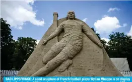  ?? ?? BAD LIPPSPRING­E: A sand sculpture of French football player Kylian Mbappe is on display at the ‘Sandwelten 2024’ garden show in Bad Lippspring­e, western Germany. — AFP