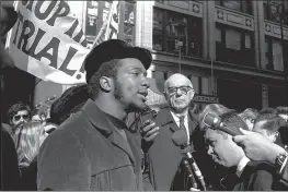  ?? ESK — THE ASSOCIATED PRESS FILE ?? Fred Hampton, center, chairman of the Illinois Black Panther party, speaks outside a rally outside the U.S. Courthouse in Chicago.