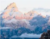  ?? KARENBLEIE­R/GETTY-AFP2012 ?? The sun hits the tips of the GrandTeton­s in GrandTeton National Park.