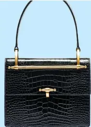  ??  ?? Croco handbag, $34,820, from Prada.