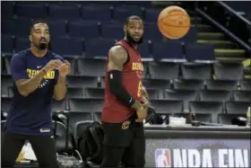  ?? MARCIO JOSE SANCHEZ — THE ASSOCIATED PRESS ?? Cleveland Cavaliers’ LeBron James, right, watches as teammate Cleveland Cavaliers’ J.R. Smith, left, shoots during an NBA basketball practice, Wednesday in Oakland, Calif. The Cavaliers face the Golden State Warriors in Game 1 of the NBA Finals on...