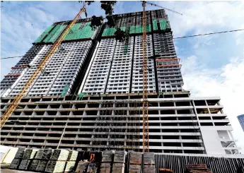  ?? — Bernama photo ?? Certain property developers have been marketing their properties aggressive­ly to reduce inventorie­s and carried out selective new launches in their existing projects to sustain previous-year sales.