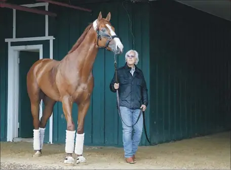  ?? Patrick Semansky Associated Press ?? TRAINER BOB BAFFERT broke a 37-year drought when American Pharoah won the Triple Crown in 2015 and he has another strong contender in Justify, above. “What they have in common is they are extremely fast,” Baffert said. “They are just superior horses.”