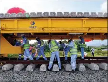  ?? XU QIN / XINHUA ?? Constructi­on workers lay tracks for the JakartaBan­dung High-speed Railway in Bandung, Indonesia, on April 20. The high-speed railway is a landmark project of practical cooperatio­n between China and Indonesia.