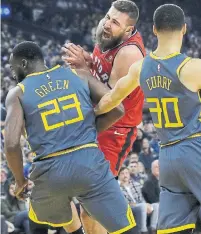  ?? JEFF CHIU THE ASSOCIATED PRESS FILE PHOTO ?? Raptors centre Jonas Valanciuna­s dislocated his left thumb in a mid-December game against the Golden State Warriors.