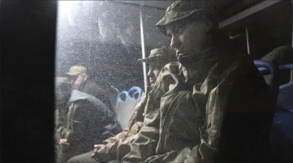  ?? ?? AND THEY’RE OUT: Ukrainian servicemen sit in a bus after they left the besieged Mariupol’s Azovstal steel plant, near a penal colony in Olyonivka, in territory under the government of the Donetsk People’s Republic, eastern Ukraine, Friday.