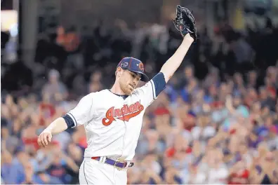  ?? JOHN MINCHILLO/ASSOCIATED PRESS ?? Indians pitcher Shane Bieber reacts after striking out the National League’s Ronald Acuna Jr. to end the top of the fifth inning in Tuesday’s All-Star game. Bieber struck out the side and was named the game’s MVP.