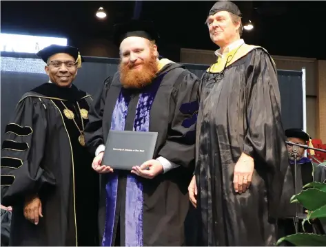  ?? (Special to The Commercial/University of Arkansas at Pine Bluff) ?? University of Arkansas at Pine Bluff Chancellor Laurence B. Alexander (left) presents Jeremiah Salinger his doctoral degree along with his adviser, Professor Steve Lochmann.