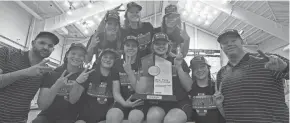  ?? OSU ?? Members of the Ohio State women’s swimming and diving team, including sophomore Nyah Funderburk­e (back row, far right), celebrate with the Big Ten championsh­ip trophy. Funderburk­e, whose father, Lawrence, played basketball for the Buckeyes, is a 2021 graduate of Columbus School for Girls.