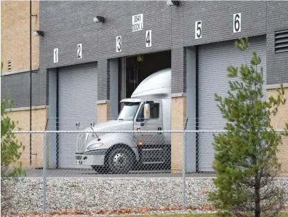  ?? PAUL SANCYA/ AP ?? A truck is seen Saturday at the Pfizer Global Supply Kalamazoo manufactur­ing plant in Portage, Michigan.