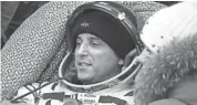  ??  ?? NASA astronaut Joe Acaba rests after landing Feb. 28 in a remote area southeast of Zhezkazgan, Kazakhstan. ALEXANDER NEMENOV / VIA AP / FILE