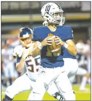  ?? Special to NWA Democrat-Gazette/DAVID BEACH ?? Bentonvill­e West quarterbac­k Will Jarrett looks for a receiver Friday against Rogers Heritage.