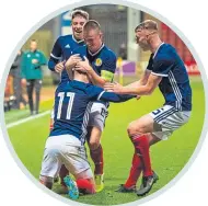  ??  ?? Scotland’s Under-19s celebrate their winner against Germany, scored by Josh Mcpake (No. 11), who’s currently on loan at Dundee from Rangers