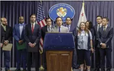  ?? PHOTO/NICK UT ?? Assemblyme­mber David Chiu, D-San Francisco, Chair of the Assembly Committee on Housing and Community Developmen­t (center) at podium, speaks during a news conference in Los Angeles. AP