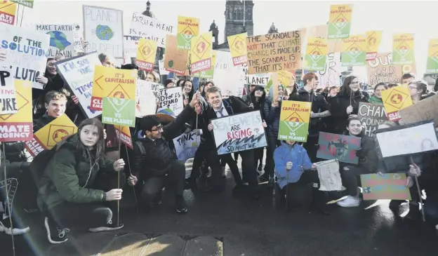  ??  ?? 0 Pupils taking part in one of the climate change strikes earlier this year – more action is planned by the Scottish Youth Climate Strike group in September