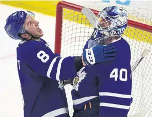  ?? STEVE RUSSELL/TORONTO STAR FILE PHOTO ?? Marlies defenceman Travis Dermott and goalie Garret Sparks celebrate after a Game 2 win over Lehigh Valley in the AHL Eastern final. They’ll host Game 1 of the Calder Cup final on Saturday.