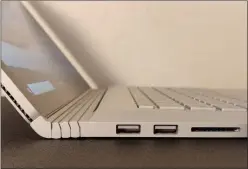  ??  ?? A pair of USB Type A ports and a full-sized SD card slot are on the left side of the Surface Book 3. You can see part of the tablet venting, running up the side of the display.