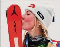  ?? Piermarco Tacca / Associated Press ?? Mikaela Shiffrin shows some appreciati­on to her skis after winning a World Cup slalom Saturday, her 85th win on the circuit, to pull within one of Ingemar Stenmark’s career mark set 34 years ago.