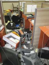  ??  ?? Some damaged systems in a ransacked office with other items dsestroyed by protesting workers