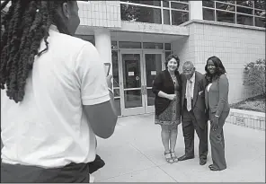  ?? NWA Democrat-Gazette/JASON IVESTER ?? L. Clifford Davis has his photo taken Thursday outside the University of Arkansas School of Law with Tamla Lewis (right), associate dean, and Stacy Leeds, dean. His great-nephew Lionel Davis II is taking the photo.