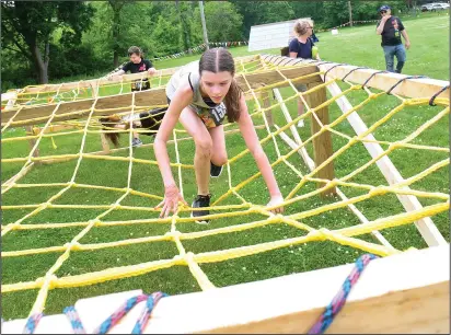  ?? Call photo/Ernest A. Brown ?? Milana Clark, 13, of Middletown, competes in the Reviver Challenge obstacle course, an all-elements fitness challenge, at MacColl YMCA in Lincoln Saturday morning.