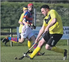  ?? Photograph: Iain Ferguson, alba.photos ?? Neil Clark of Fort William gains control of the ball and powers down the wing during his team’s game against Kingussie at the weekend.