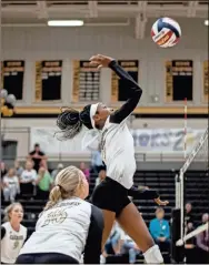  ??  ?? Asiyah Pritchett goes up for a kill during a recent Calhoun volleyball match in this file photo.