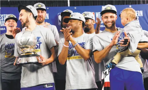  ?? Photos by Scott Strazzante / The Chronicle ?? Klay Thompson, Quinn Cook and Stephen Curry exult after a 119-117 overtime win over Portland Trail Blazers.