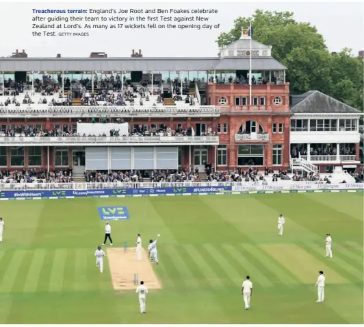  ?? GETTY IMAGES ?? Treacherou­s terrain: England’s Joe Root and Ben Foakes celebrate after guiding their team to victory in the first Test against New Zealand at Lord’s. As many as 17 wickets fell on the opening day of the Test.