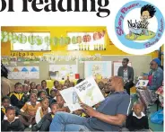  ??  ?? STORYTIME: Book Lounge’s Lwandiso Ntanga reads to children