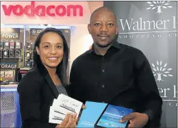  ?? Picture EUGENE COETZEE ?? THE PRIZES: Walmer Park Shopping Centre marketing manager Deveda Bloem and Vodacom Eastern Cape marketing manager Mninawa Peter show off some of the prizes awaiting Matric of the Year finalists