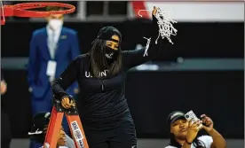  ?? MICHAEL CONROY / AP ?? Katrina Merriweath­er celebrates after Wright State defeated IUPUI 53-41 to win the Horizon League conference tournament championsh­ip on March 9.