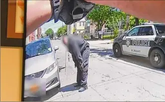  ?? Will Waldron / Times Union ?? Police body camera footage shows the suspect after he was shot Monday on Franklin Street. Police say he stabbed a police officer who was trying to take him into custody.