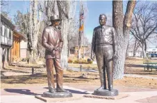  ?? ?? View of the statues of J. Robert Oppenheime­r (left) and Brigadier General Leslie R. Groves Jr. near the Fuller Lodge in Manhattan Project National Historical Park, in Los Alamos, New Mexico.