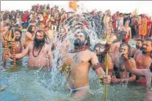 ?? SHEERAZ RIZVI/HT ?? ▪ Naga Sadhus take a holy dip at Sangam on the auspicious Makar Sankranti day during the Kumbh Mela in Prayagraj