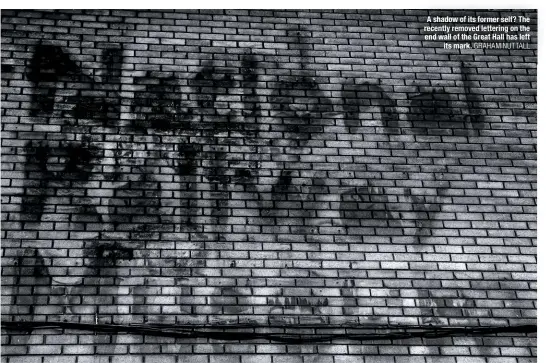  ?? GRAHAM NUTTALL ?? A shadow of its former self? The recently removed lettering on the end wall of the Great Hall has left its mark.