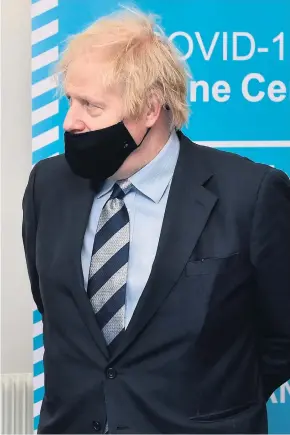  ??  ?? Push: Prime Minister Boris Johnson speaks with First Minister Arlene Foster during a visit to the Lakeland Forum vaccinatio­n centre in Enniskille­n last week