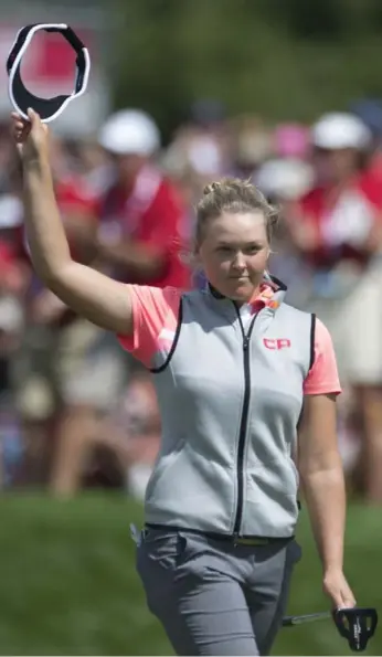  ?? ADRIAN WYLD/THE CANADIAN PRESS ?? Brooke Henderson, an honorary member at the Ottawa Hunt and Golf Club, shot a course-record 63 on Saturday.