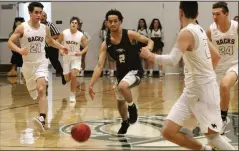  ?? MIKE BUSH/NEWS-SENTINEL ?? Liberty Ranch guard Jalen Patterson (2) manouvers among a group of Union Mine players at The Hawks Nest on Feb. 1. Patterson scored 28 points, which puts him as the school's new all-time leading scorer.