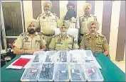  ?? HT PHOTO ?? Police show the arms recovered from the accused (face covered) in Tarn Taran on Friday.